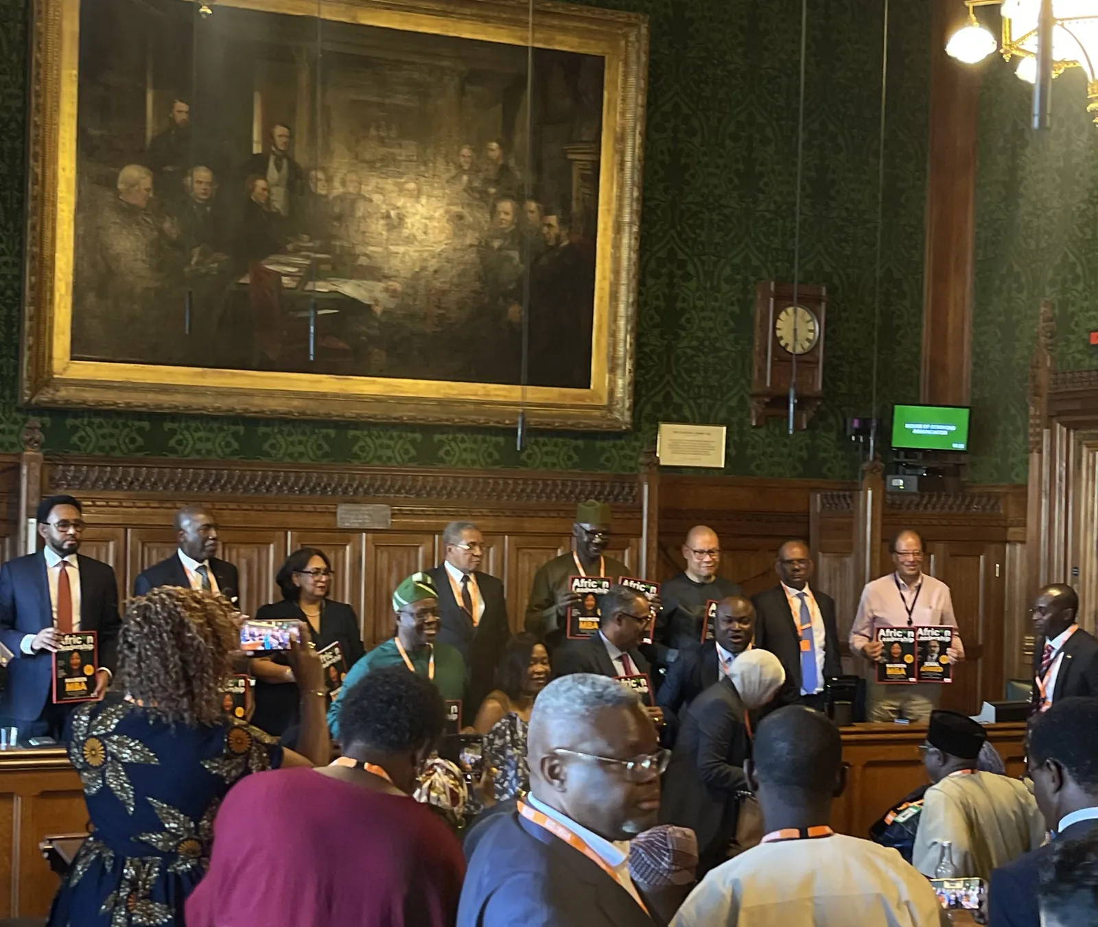 Guests gathered under a large painting at an African leadership event in the House of Lords